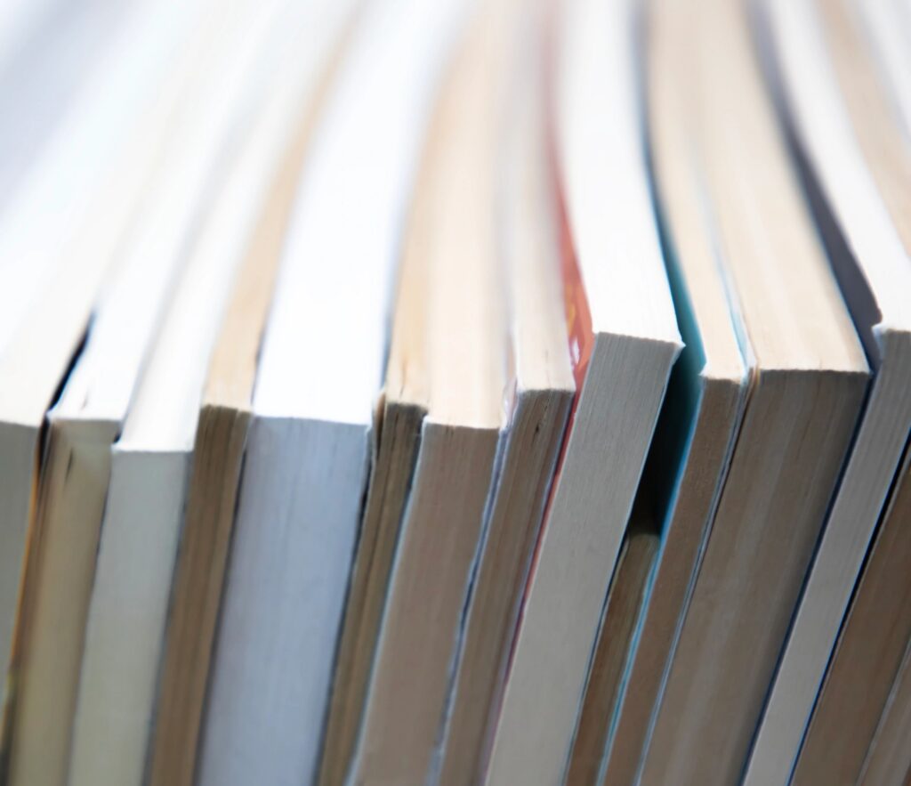 stack of books on self. abstract background with books edge. copy space for text.